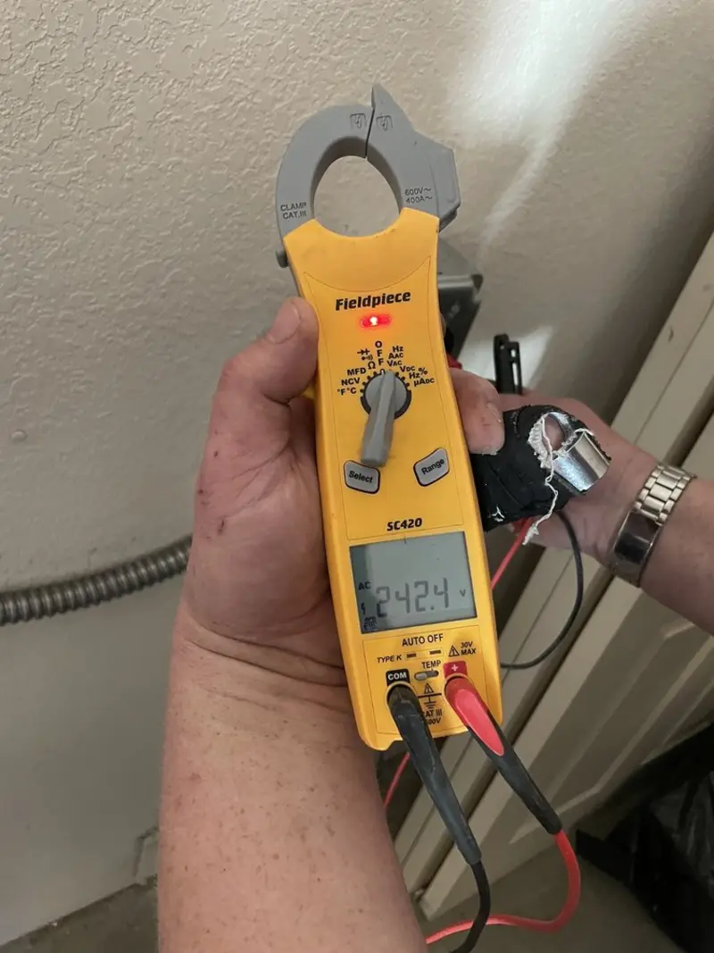 Voltage testing with clamp meter during Electrical Installation Services in Bourbonnais